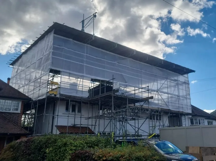 Specialist temporary roof scaffold and protective sheeting viewed from the street